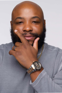 Dr. Anthony Batts II smiling in a grey shirt