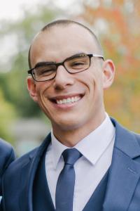 Fernando Duran smiling in a suit